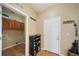 Functional mudroom with tile floors, storage cabinets, and easy access to both the laundry area and outdoors at 40900 Red Fox Cir, Elizabeth, CO 80107