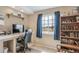 Comfortable office space with a computer desk, office chair, and natural light from the window at 40900 Red Fox Cir, Elizabeth, CO 80107