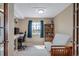 Comfortable office space with desk, futon and a window offering natural light at 40900 Red Fox Cir, Elizabeth, CO 80107