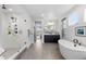 Luxurious bathroom with a walk-in shower, soaking tub, and contemporary finishes at 7077 Copper Sky Cir, Castle Pines, CO 80108