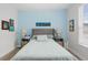 Inviting bedroom features a plush gray headboard, soft blue walls, and coordinated decor for a calming retreat at 7077 Copper Sky Cir, Castle Pines, CO 80108