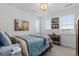 Comfortable bedroom featuring a cozy bed, soft lighting, and charming artwork, creating a relaxing atmosphere at 7077 Copper Sky Cir, Castle Pines, CO 80108