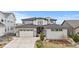 Beautiful home with a two-car garage, neutral exterior, and well-maintained landscaping at 7077 Copper Sky Cir, Castle Pines, CO 80108