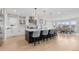 Spacious kitchen with large island, stylish pendant lighting, and modern appliances at 7077 Copper Sky Cir, Castle Pines, CO 80108