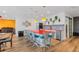 Modern kitchen with a red island, bar seating, and colorful backsplash at 7077 Copper Sky Cir, Castle Pines, CO 80108