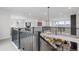 Spacious loft area with comfortable seating and a view of the living room below at 7077 Copper Sky Cir, Castle Pines, CO 80108