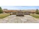 Stone patio and fire pit are great for entertaining with an amazing view at 7077 Copper Sky Cir, Castle Pines, CO 80108