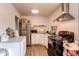 Updated kitchen features stainless steel appliances, white cabinets, and plenty of counter space at 6800 E Tennessee Ave # 461, Denver, CO 80224