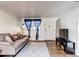 Comfortable living room with neutral paint, modern decor, and wood-look floors at 6800 E Tennessee Ave # 461, Denver, CO 80224