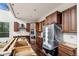 Unfinished kitchen featuring new cabinetry, stainless steel appliances, and dark hardwood floors at 1810 Saddleback Dr, Evergreen, CO 80439