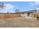 Spacious backyard with a wooden fence, patio, and grill at 4810 W 8Th Ave, Denver, CO 80204