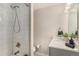 Modern bathroom featuring a subway tiled shower, contemporary vanity with ample storage, and updated fixtures at 4810 W 8Th Ave, Denver, CO 80204
