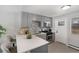 Updated kitchen with modern appliances, a breakfast bar, and plenty of cabinet space for all your culinary needs at 4810 W 8Th Ave, Denver, CO 80204