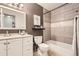 Modern bathroom with a shower-tub combo, stylish vanity, and neutral tones for a clean aesthetic at 14602 E 2Nd Ave # 303C, Aurora, CO 80011