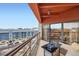 Relaxing covered balcony with seating offering skyline views at 100 Park W Ave # 605, Denver, CO 80205