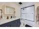 Modern bathroom features a vanity with a marble countertop and a walk-in shower at 100 Park W Ave # 605, Denver, CO 80205