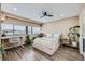 Cozy bedroom with large windows, neutral color palette, and hardwood floors at 100 Park W Ave # 605, Denver, CO 80205