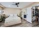 Cozy bedroom showcases plush bedding, modern lighting, closet, and ensuite bathroom at 100 Park W Ave # 605, Denver, CO 80205