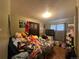 Cozy bedroom featuring wood floors, a window with curtains, and plenty of plush toys at 260 Sheridan Blvd, Denver, CO 80226