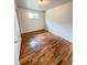 Cozy bedroom with hardwood floors and natural light from a single window at 260 Sheridan Blvd, Denver, CO 80226