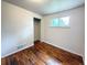 Empty bedroom has wood floors, a window, and a closet ready for customization at 260 Sheridan Blvd, Denver, CO 80226