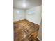 Sunlit bedroom with two windows, hardwood floors, and neutral décor at 260 Sheridan Blvd, Denver, CO 80226