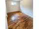 Bright bedroom features hardwood floors, a window, and ample space at 260 Sheridan Blvd, Denver, CO 80226