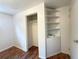 A bedroom closet featuring built-in shelving and ample storage space at 260 Sheridan Blvd, Denver, CO 80226