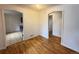 Open dining room, adjacent to the kitchen, featuring hardwood floors and connecting archways at 260 Sheridan Blvd, Denver, CO 80226