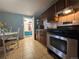 Cozy kitchen featuring tile floors, a dining table and access to the outdoor patio at 260 Sheridan Blvd, Denver, CO 80226