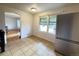 Bright kitchen features tiled floors and stainless-steel appliances at 260 Sheridan Blvd, Denver, CO 80226