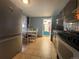Galley kitchen features tile floor and dining table and access to the outdoor patio at 260 Sheridan Blvd, Denver, CO 80226
