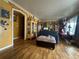 Cozy living room with hardwood floors, eclectic decor and a charming archway at 260 Sheridan Blvd, Denver, CO 80226