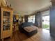 A living room with hardwood floors, bright yellow walls, and unique decorations at 260 Sheridan Blvd, Denver, CO 80226
