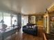 Sunlit living room with hardwood floors, unique decorations and a spacious feel at 260 Sheridan Blvd, Denver, CO 80226
