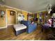 Cozy living room featuring hardwood floors, eclectic decor and a charming archway at 260 Sheridan Blvd, Denver, CO 80226
