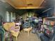 Shed interior is filled with furniture, books, bikes and storage bins at 260 Sheridan Blvd, Denver, CO 80226
