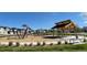 Community playground with modern equipment and shaded seating at 702 N Bently St, Watkins, CO 80137