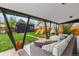 Inviting covered patio with comfortable seating and views of the backyard play area at 3103 W Bellewood Dr, Englewood, CO 80110