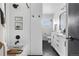 Modern bathroom features sleek black and white finishes, plus shower and vanity at 3103 W Bellewood Dr, Englewood, CO 80110