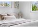 Bright bedroom with plush bedding, natural light, and neutral decor at 3103 W Bellewood Dr, Englewood, CO 80110
