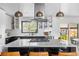 Well-lit, modern kitchen with a spacious island, stainless steel appliances, and ample storage at 3103 W Bellewood Dr, Englewood, CO 80110