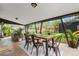 Covered patio with outdoor dining and seating area in the backyard, perfect for entertaining at 3103 W Bellewood Dr, Englewood, CO 80110