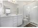 Bright bathroom with double sink vanity and a glass-enclosed walk-in shower at 1342 Independence St # 6, Lakewood, CO 80215