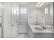 Spacious bathroom with a double sink vanity, featuring granite counters and a large mirror at 1342 Independence St # 6, Lakewood, CO 80215