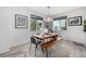 Dining room with natural wood table and modern light fixture at 1342 Independence St # 6, Lakewood, CO 80215