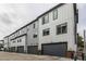 A row of modern townhomes with garages at 1342 Independence St # 6, Lakewood, CO 80215