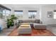 Bright living room with neutral sectional couch and large windows at 1342 Independence St # 6, Lakewood, CO 80215