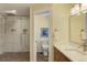 Elegant bathroom with marble walk-in shower, modern fixtures, and well-lit vanity at 20101 Spring Gulch Rd, Morrison, CO 80465