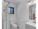 Modern bathroom with tile floors, and a glass shower enclosure at 20101 Spring Gulch Rd, Morrison, CO 80465